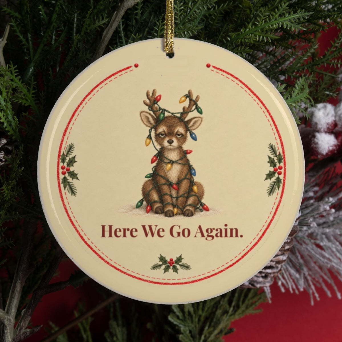 Funny reindeer Christmas ornament that says Here We Go Again, tangled lights