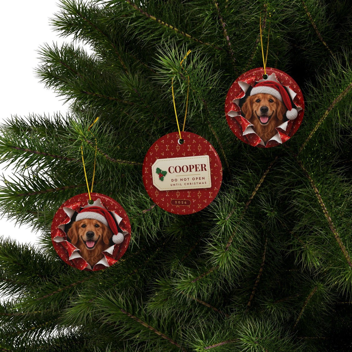 Three Golden Retriever ornaments hanging on a Christmas tree