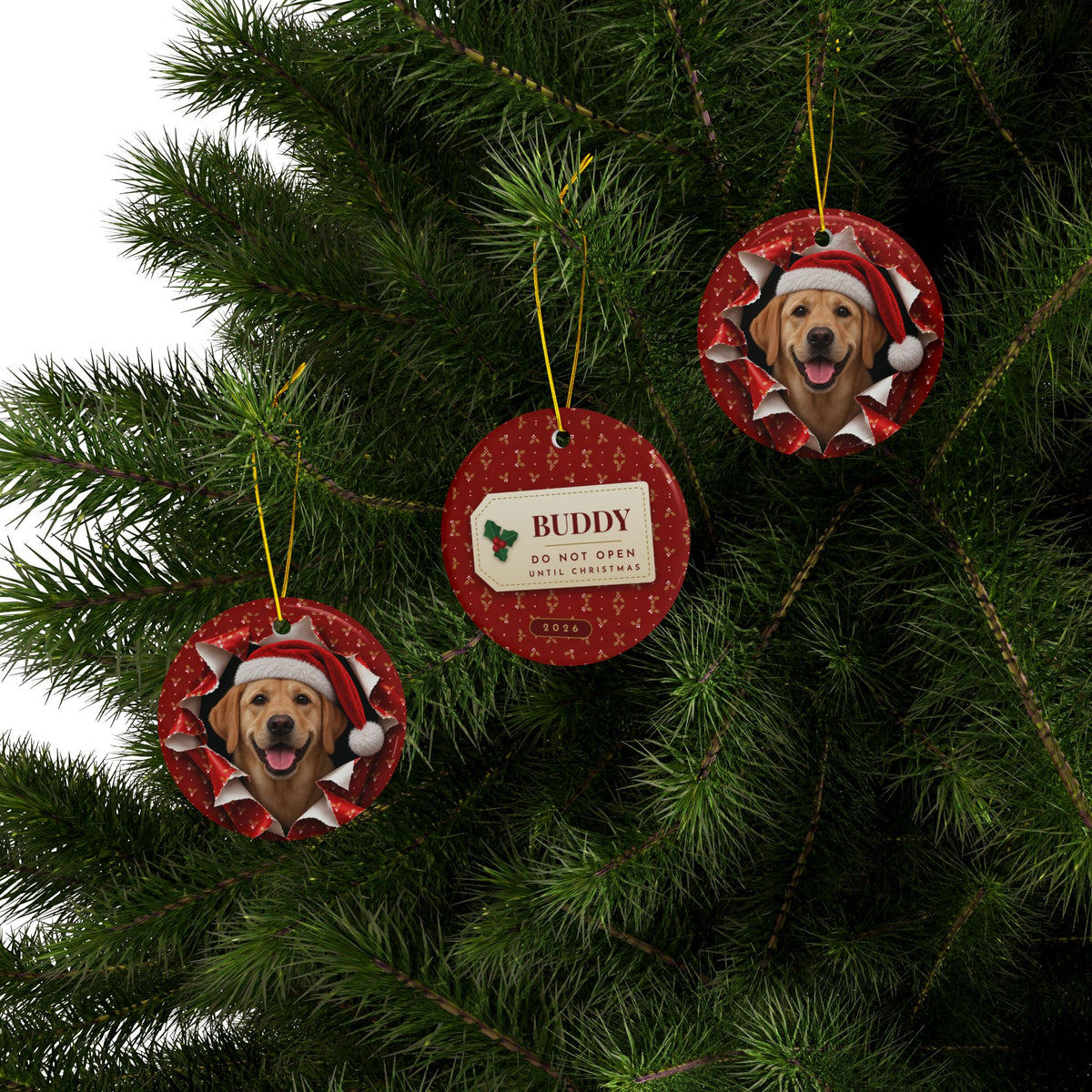 Three Yellow Lab ornaments hanging on a Christmas tree